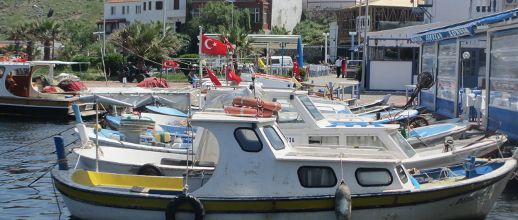 Boats sit in the sun near Bozcaada port