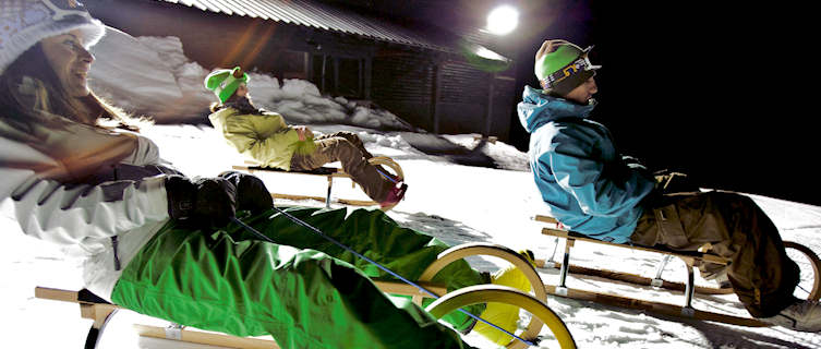 Enjoy floodlit tobogganing