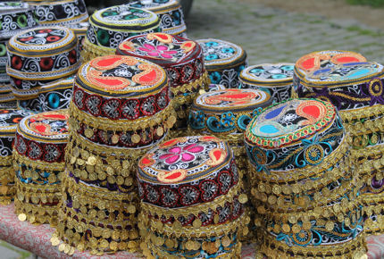 Colourful taqiyahs (prayer hats) line the stalls in the Old City