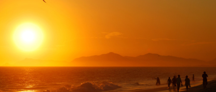 A paraglider enjoys the sunset in Rio de Janeiro