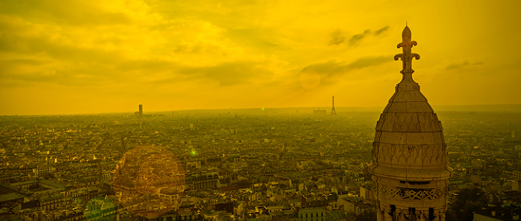 The sun rises over Sacre Coeur church in Montmartre