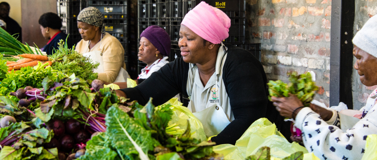 The Harvest of Hope ladies sell their goods