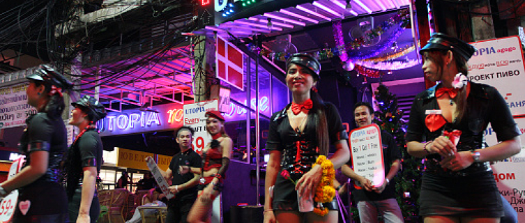 Women trying to entice customers into Utopia in Patpong, Bangkok