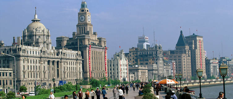 Pedestrians walking along Shanghai's waterfront