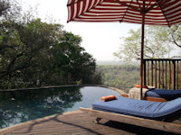 Relax poolside at Singita  Pamushana Lodge