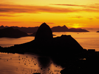 Sunset casts a golden glow over Sugar Loaf Mountain, Brazil